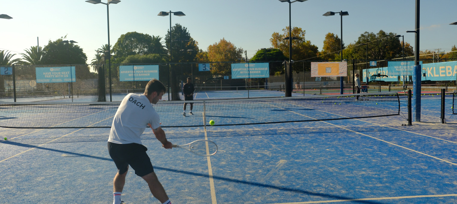 Coaching session on the tennis courts at Elsternwick Park Tennis Centre