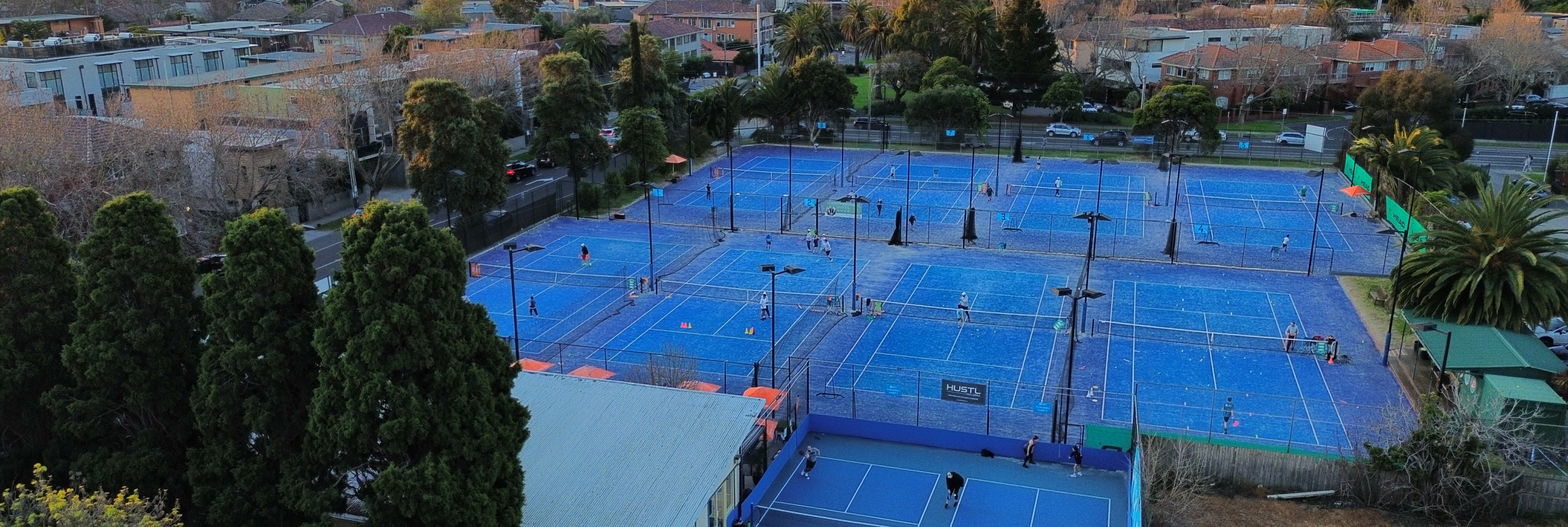 Wide view of the tennis courts at Elsternwick Park